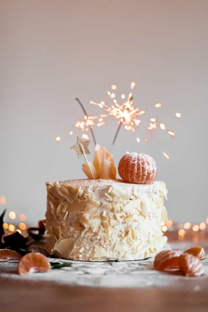 cake with lit sparkling stick